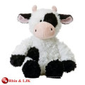 Juguete de peluche de vaca blanco y negro